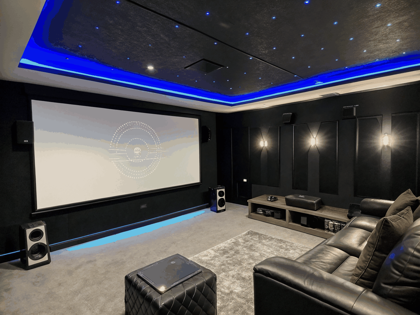 Modern home theater room in a contemporary house featuring a large screen and sleek architectural design