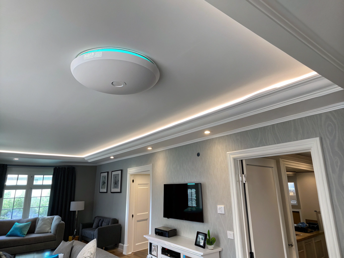 Modern WiFi access point and router mounted cleanly on a contemporary residential ceiling